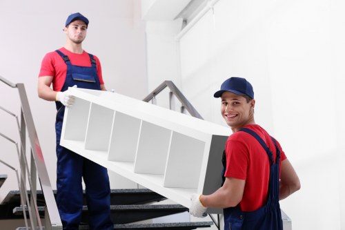 Professional movers loading household items with care in Kingston