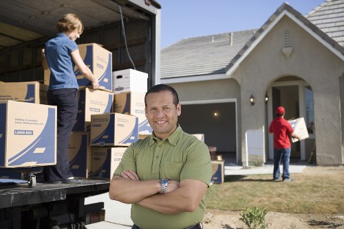 Office relocation planning in Kingston with moving equipment and packed boxes