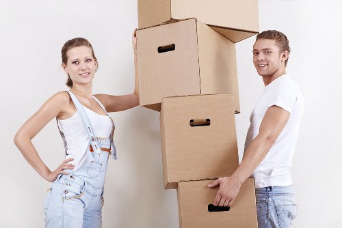 House removalists transporting packed boxes and furniture through Kingston