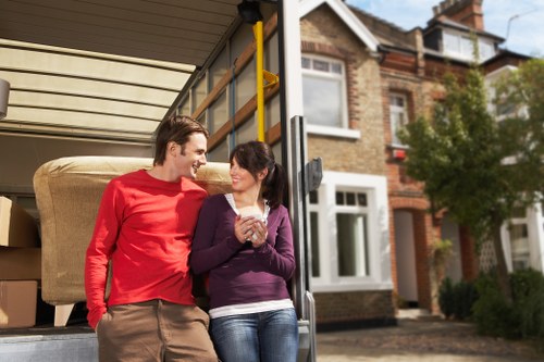 Careful loading of boxes and furniture during a Kingston flat move