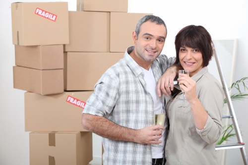 Loading furniture and boxes into a van for a Kingston removal job